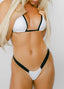 Person wearing a white bikini with black straps on a plain background